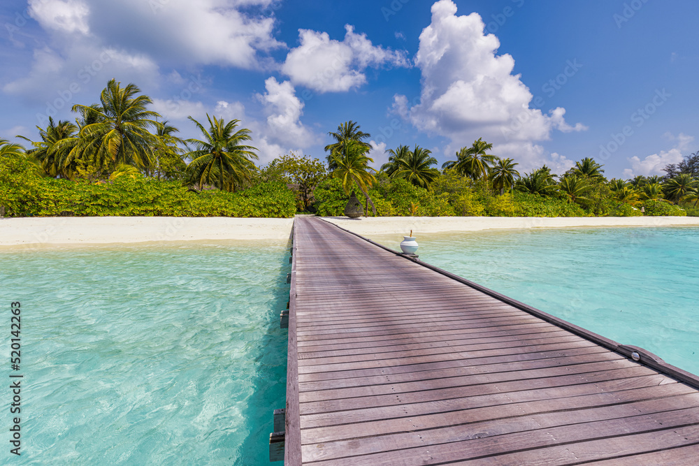 Tranquility travel background, wooden pier pathway in paradise summer beach. Tropical island landscape, calm sea water, white sand, palm trees blue sunny sky. Idyllic vacation scenic, exotic nature