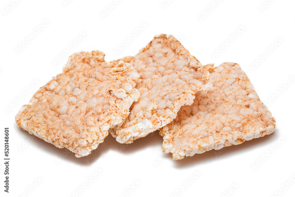 A Heap of Square Rice Cakes - Isolated on White. Dietary Crispbread - Isolation A Heap of Square Rice Cakes - Isolated on White. Dietary Crispbread - Isolation