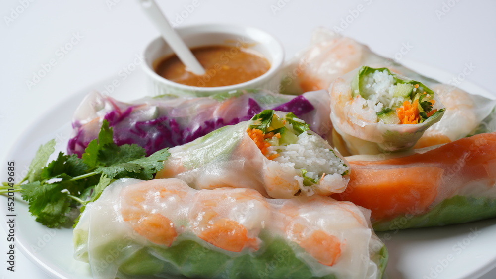 Vietnamese Spring Rolls Goi Cuon or Nem Cuon, filled with prawns, herbs, rice vermicelli and vegetables. Served with hoisin and peanut sauce dip. Vietnamese Spring Rolls Goi Cuon or Nem Cuon, filled with prawns, herbs, rice vermicelli and vegetables. Served with hoisin and peanut sauce dip.