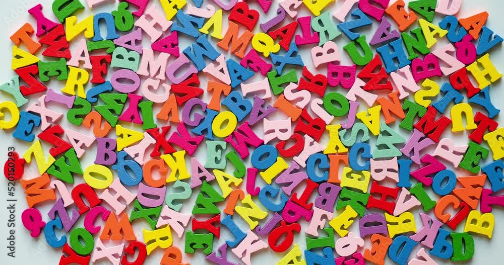Colorful wooden letters fill the background. Looped 4K stop motion animation Colorful wooden letters fill the background. Looped 4K stop motion animation