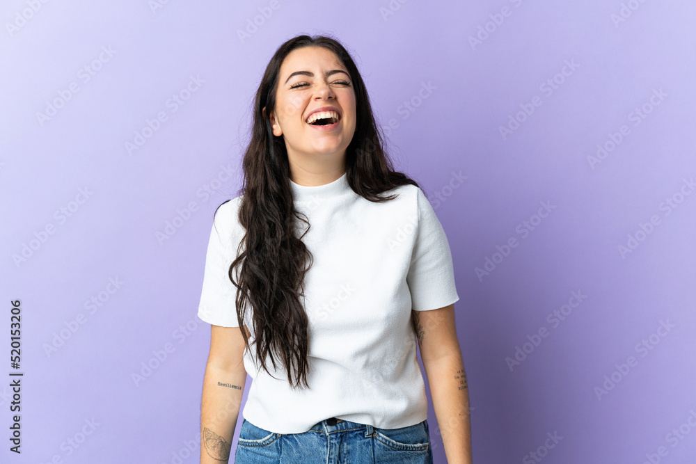 Young caucasian woman isolated on purple background laughing Young caucasian woman isolated on purple background laughing