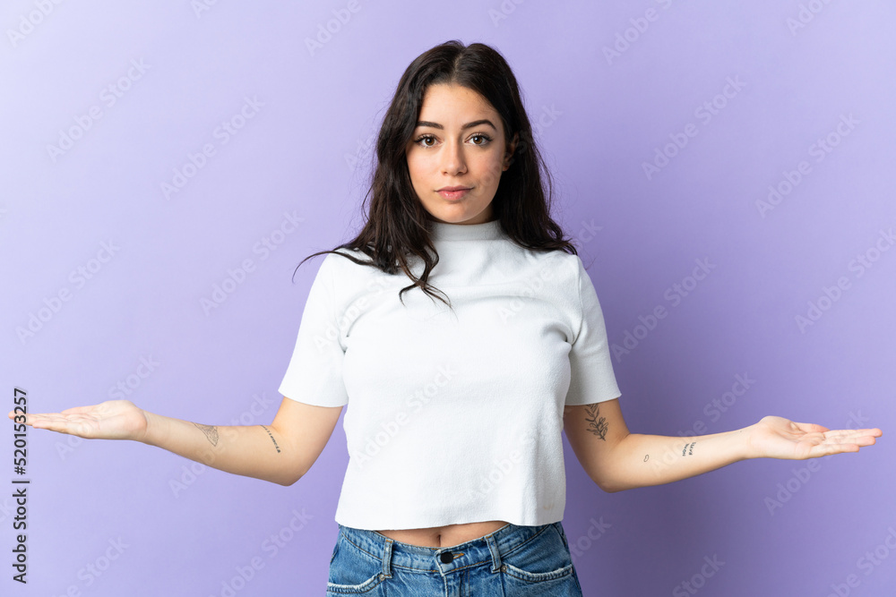 Young caucasian woman isolated on purple background having doubts Young caucasian woman isolated on purple background having doubts