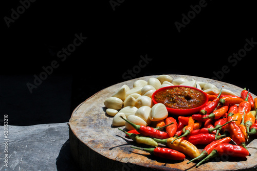 Indonesian garlic chilli sambal or sambel bawang with garlic, chilli and salt as Ingredients. authentic traditional sambal or chilli paste from indonesia. photo