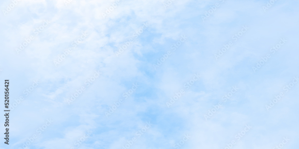 Clear and cloudy puffy and blurry blue sky background, bright and fresh blue sky and white clouds of summer or winter seasons.
