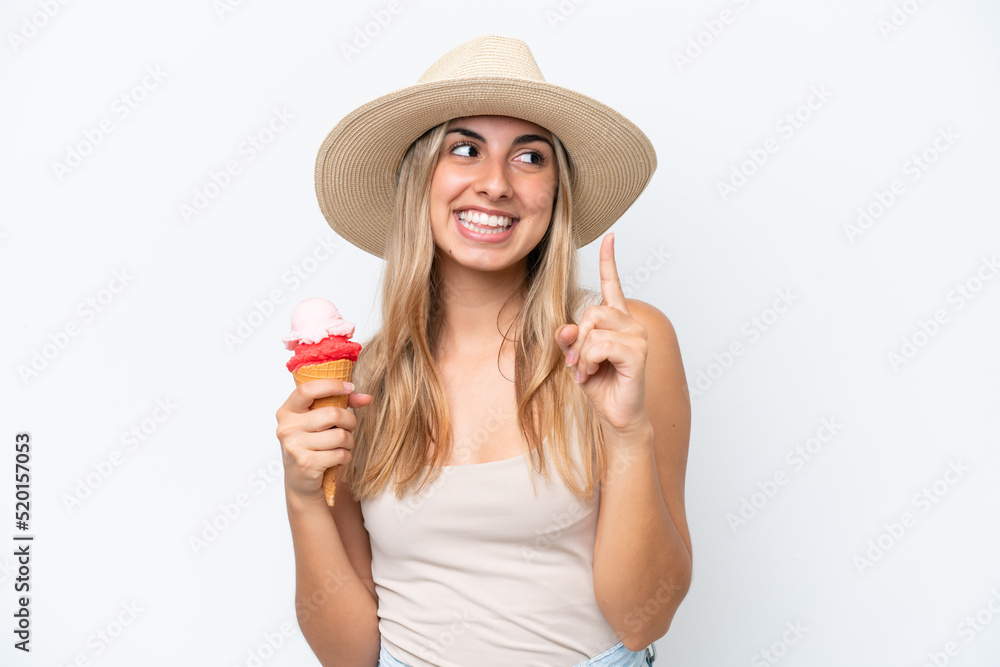 Young caucasian woman with a cornet ice cream isolated on white background intending to realizes the solution while lifting a finger up
