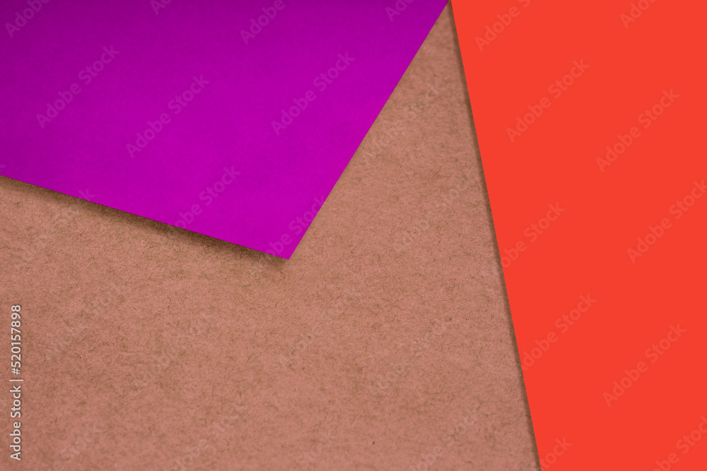 Plain and Textured purple red orange brown papers randomly laying to form M like pattern and triangle for creative cover design idea Plain and Textured purple red orange brown papers randomly laying to form M like pattern and triangle for creative cover design idea