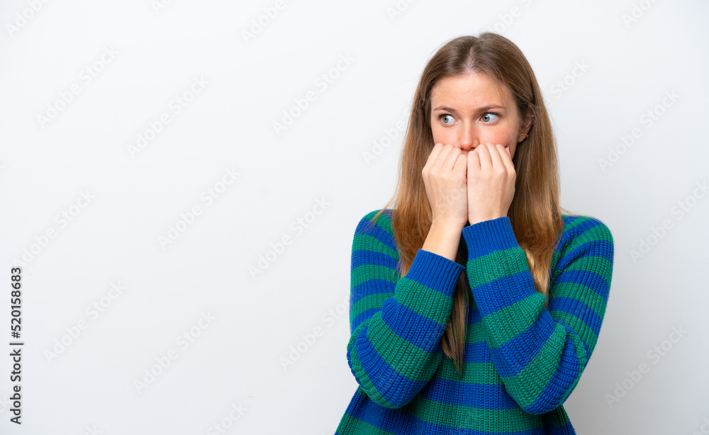 Young caucasian woman isolated on white background nervous and scared putting hands to mouth Young caucasian woman isolated on white background nervous and scared putting hands to mouth