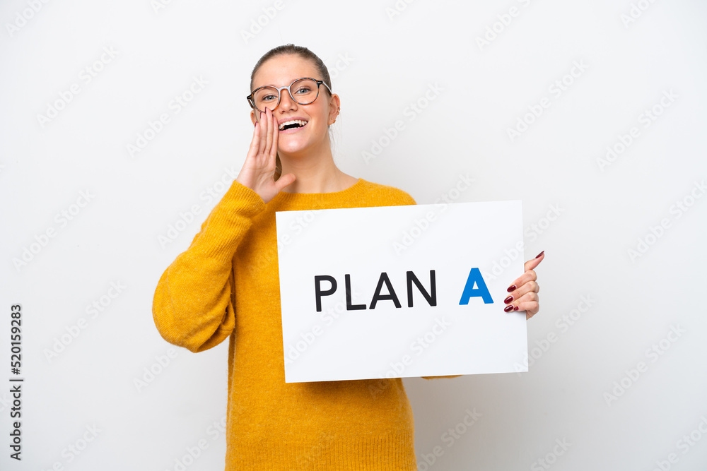 Young caucasian woman isolated on white background holding a placard with the message PLAN A and shouting Young caucasian woman isolated on white background holding a placard with the message PLAN A and shouting