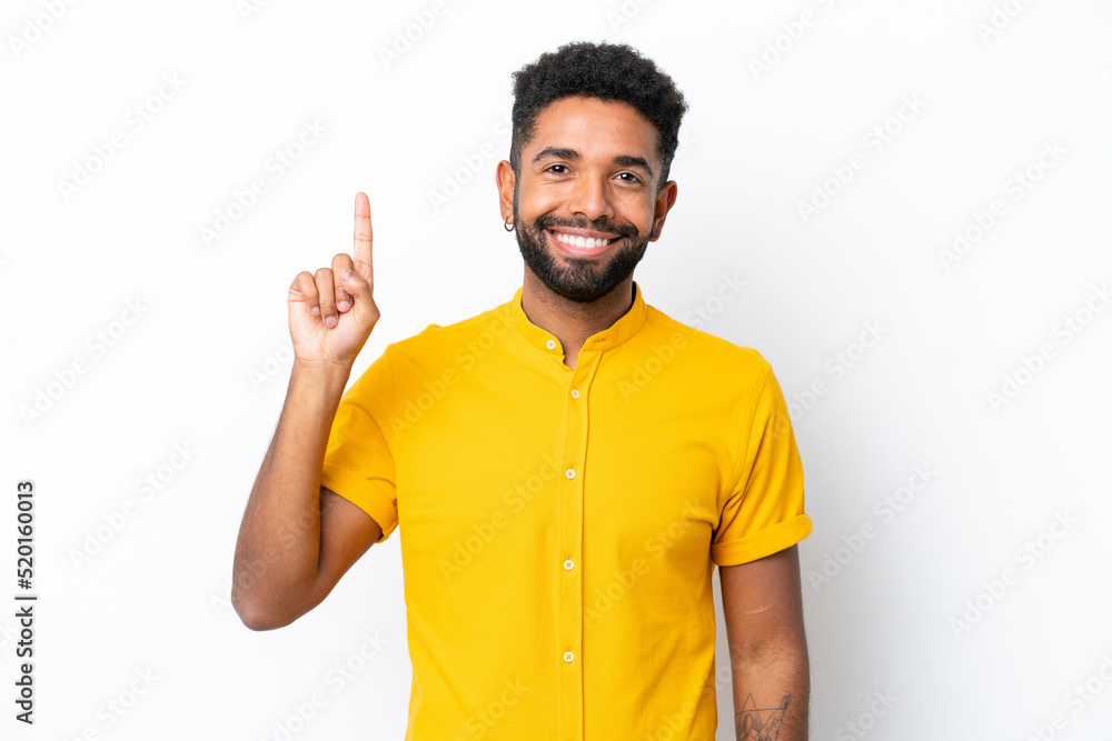 Young Brazilian man isolated on white background pointing up a great idea Young Brazilian man isolated on white background pointing up a great idea