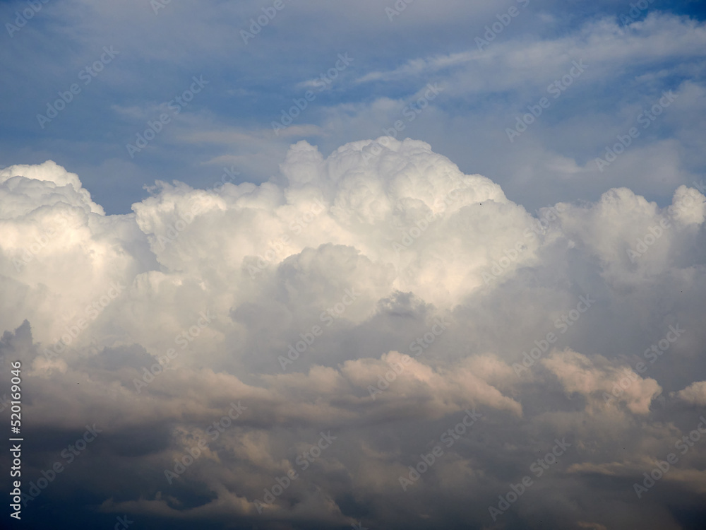 Cumulus clouds. White clouds on the blue sky close-up. Cumulus clouds. White clouds on the blue sky close-up.