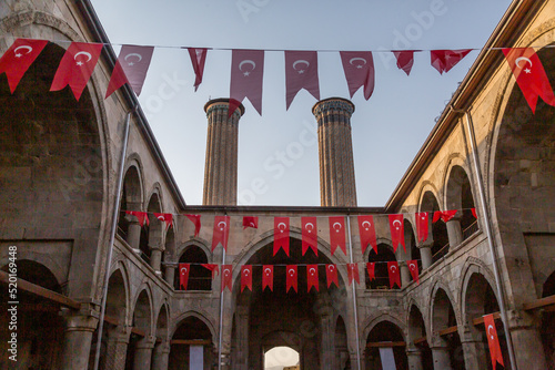 Cifte minareli (double minaret) old school inside with Turkish flags in Erzurum, Turkey