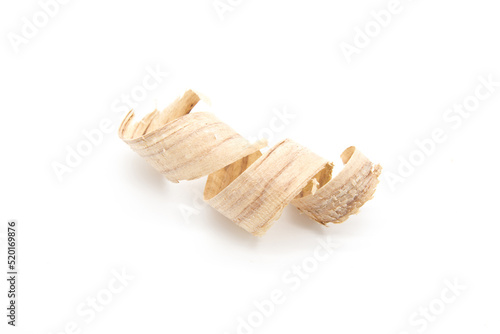 A curled wood shavings closeup isolated on white background