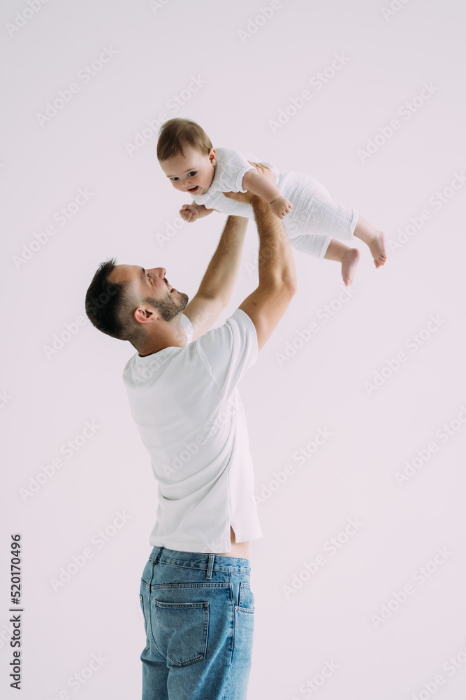 Portrait of dad playing with his son isolated on white background Portrait of dad playing with his son isolated on white background