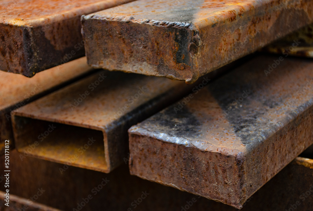 Steel profile in workshop. Rod made of metal. Steel part for construction production. Steel profile in workshop. Rod made of metal. Steel part for construction production.