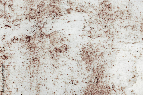 Abstract grunge background in light brown color. Background with spots, scratches and dots for your creative design.