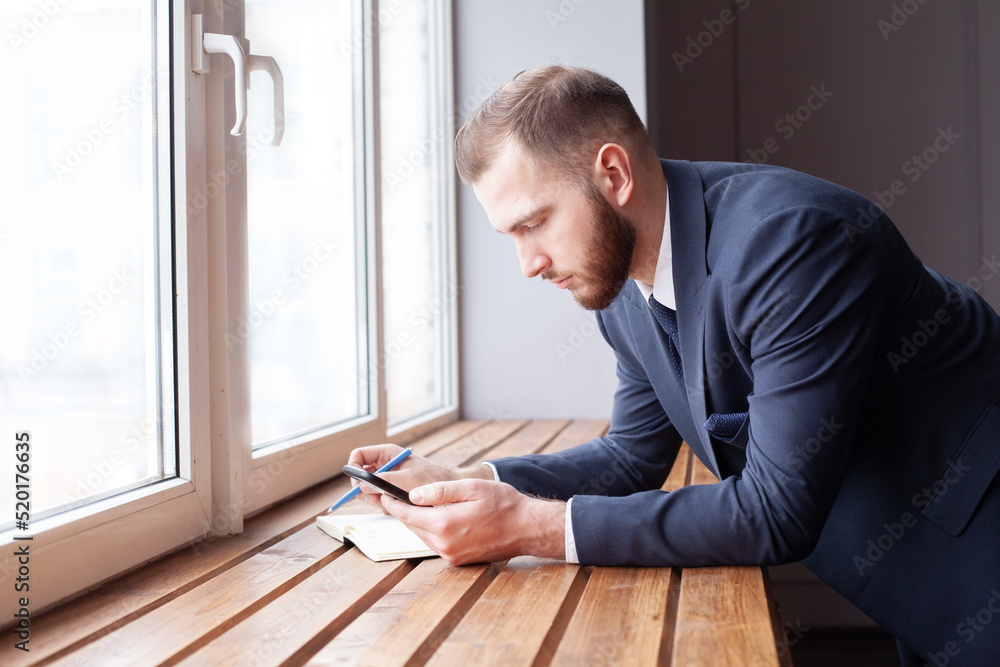 Bisiness man using internet on smart phone indoor Bisiness man using internet on smart phone indoor