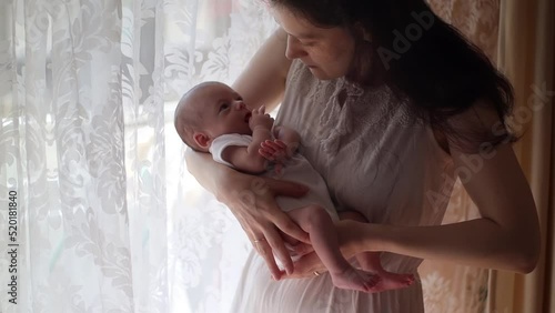 mother comforting her crying newborn baby