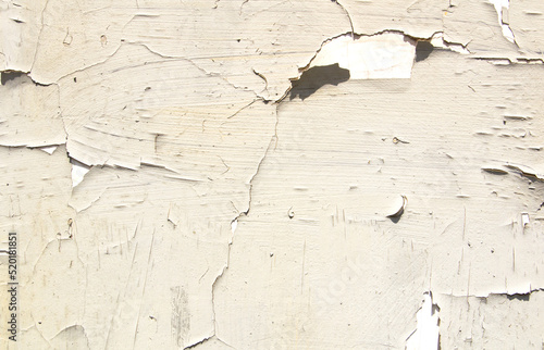 Background - cracked white-grey peeling wall.