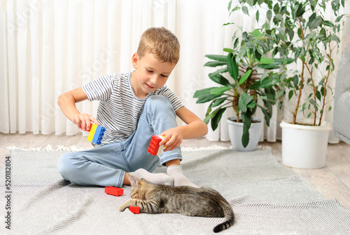 child playing with cat