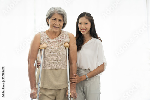 Fotografie Old woman, patient and crutches