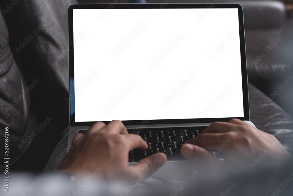 Mockup image of laptop computer, man working on laptop with blank screen at home Mockup image of laptop computer, man working on laptop with blank screen at home