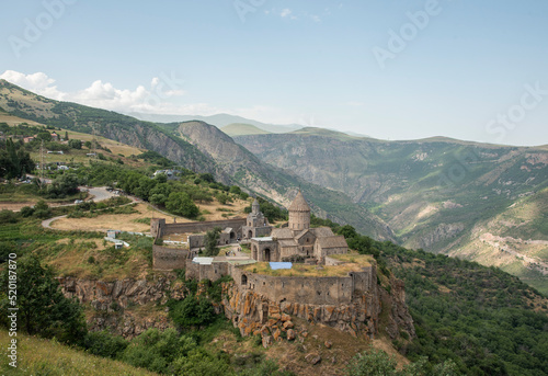 Armenia. Tatev, 9th century Armenian Apostolic Monastery, tree and mountains in the background in summer. Top view