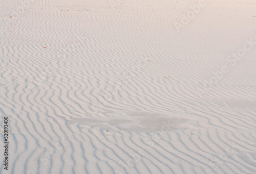 texture of wavy white sand on the beach
