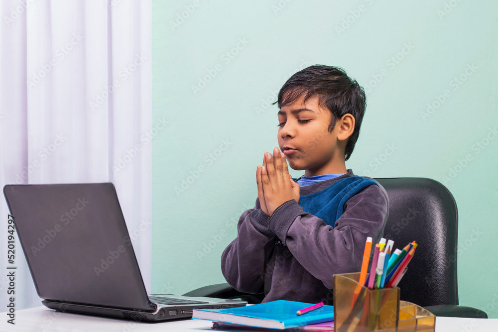 Little boys attending to online class from home. The school has been closed during coronavirus outbreak and the classes have moved to e-learning platform Little boys attending to online class from home. The school has been closed during coronavirus outbreak and the classes have moved to e-learning platform
