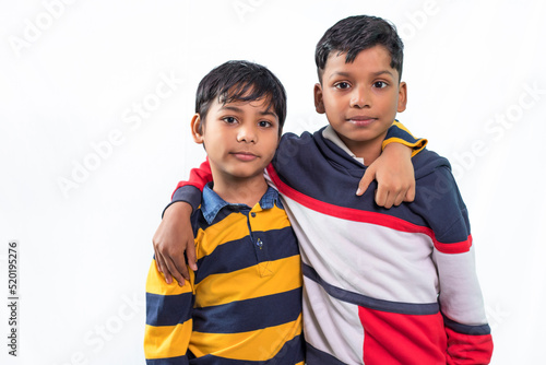 Photography Two boys standing close with hands over each others shoulder