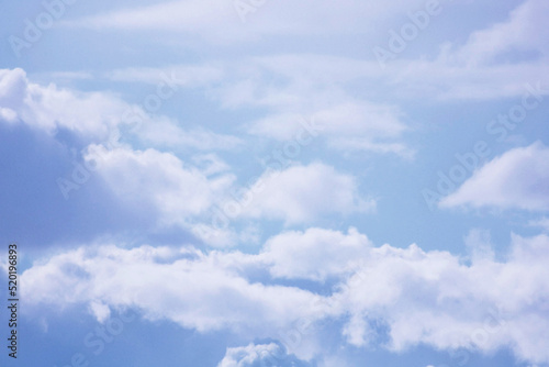Fototapeta Naklejka Na Ścianę i Meble -  Fluffy clouds in a blue sky. Beautiful weather.