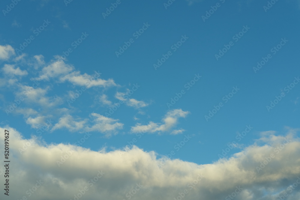 Dark blue evening sky with clouds. Blue hour. Heavenly natural background to overlay on your photos.