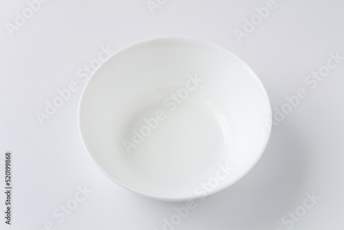 White plate isolated on white background, flat lay, top view.