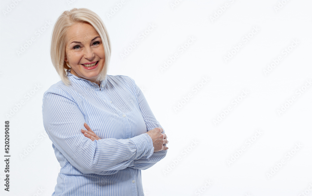 Attractive middle aged woman with folded arms on white background Attractive middle aged woman with folded arms on white background
