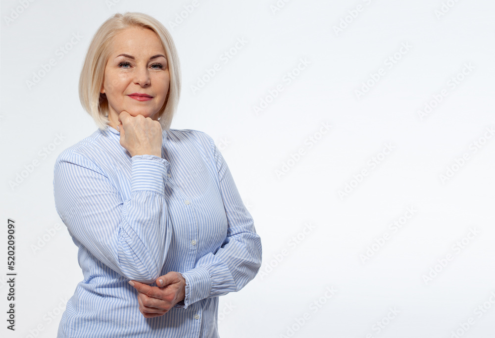 Attractive middle aged woman with folded arms on white background Attractive middle aged woman with folded arms on white background