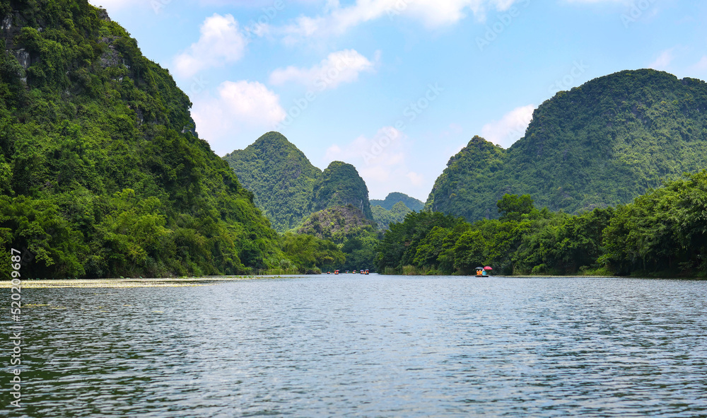 Take a cruise to see the beautiful scenery of the World Heritage Halong Land, Ninh Binh, Vietnam.