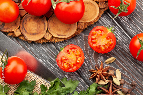 sliced cherry tomato on wood background