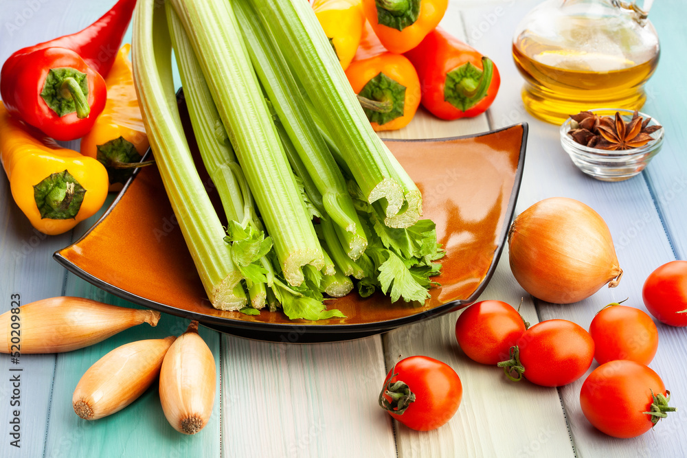 celery stalk on wood background celery stalk on wood background