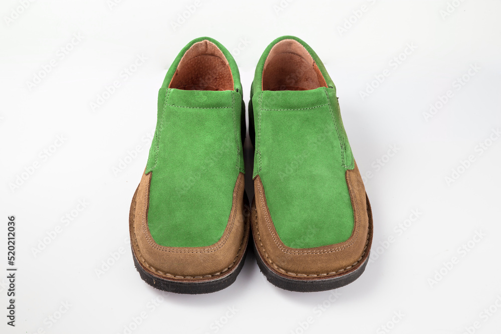 Male brown and green leather shoes on white background, isolated product. Male brown and green leather shoes on white background, isolated product.