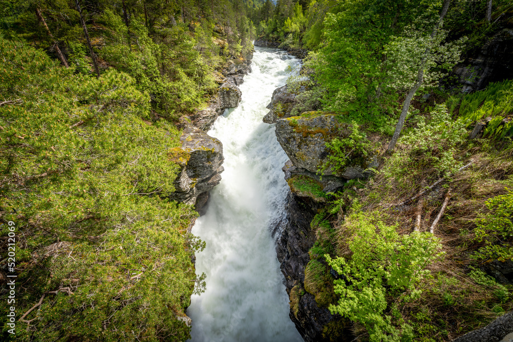 Slettafossen, a waterfall in the Rauma river, a little south of Verma (upstream) in Romsdalen in Møre og Romsdal. Slettafossen, a waterfall in the Rauma river, a little south of Verma (upstream) in Romsdalen in Møre og Romsdal.