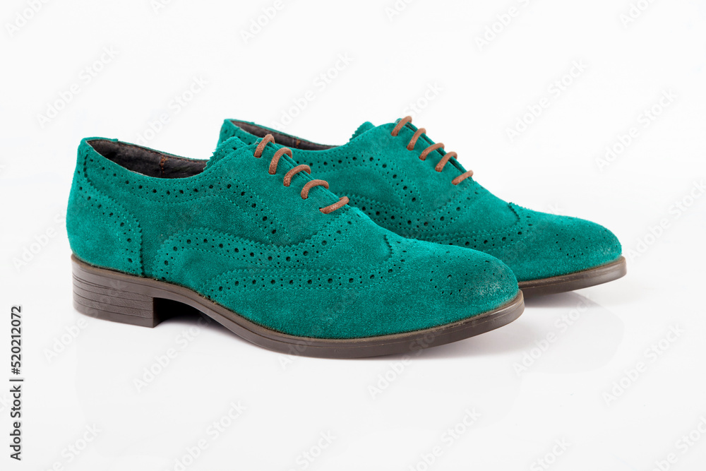 Male green leather shoe on white background, isolated product.