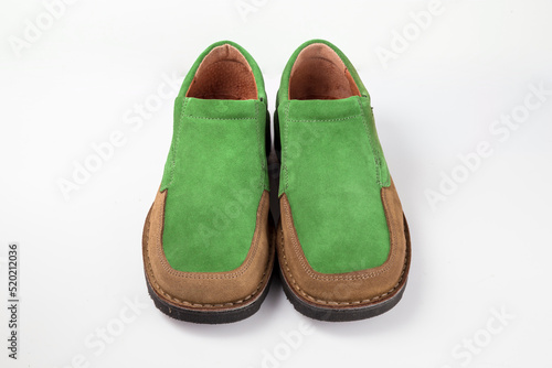 Male brown and green leather shoes on white background, isolated product.