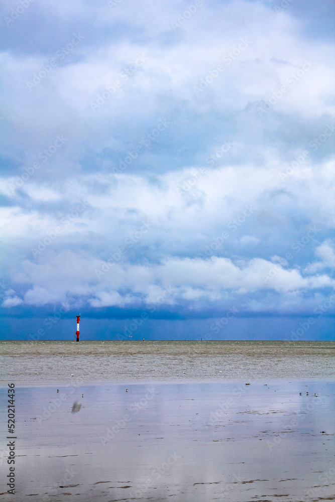 Obraz premium Industrial area cranes red tower lighthouse dyke seascape panorama Germany.