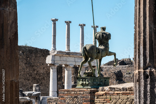 POMPEII, ITALY - MAY 04, 2022 - Beautiful statue of an ancient lancer on the forum of the ancient city of Pompeii, Italy photo