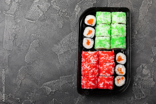 Assorted sushi. Big set of sushi. A variety of Japanese sushi with crab, salmon, eel and caviar on a black marble table. Top viewCopy space. food delivery photo