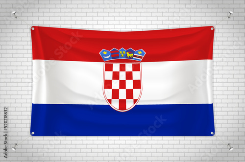 Croatia flag hanging on brick wall. 3D drawing. Flag attached to the wall. Neatly drawing in groups on separate layers for easy editing.