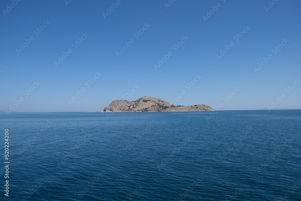 Akdamar Island view from Van Lake, Turkey. Sea, sky, island background.