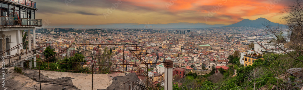 Panoramic view of sunset over Napoli's city center, Mount Vesuvius in warning in the background