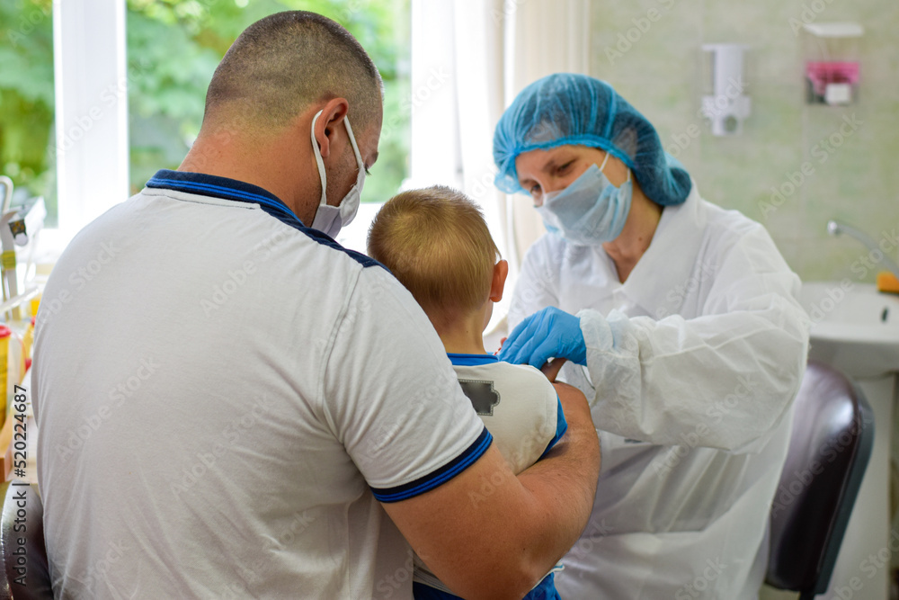 Father with son at medical consultation, doctor, patient.