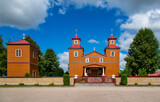 Built in the years 1924-26, a sacred complex consisting of a belfry and a wooden Catholic church dedicated to Our Lady of Częstochowa in the town of Žilina in Masuria in Poland.
