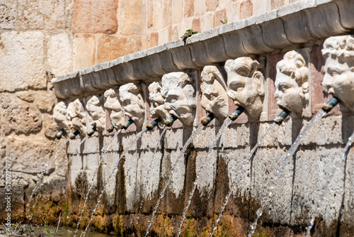 Famous mediaeval Fountain of 99 Spouts in ithe old town of L'Aquila, Italy